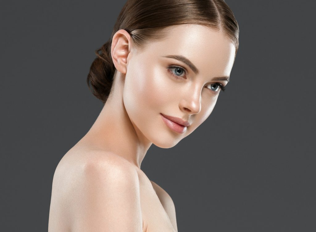 Beautiful face woman healthy skin gray background