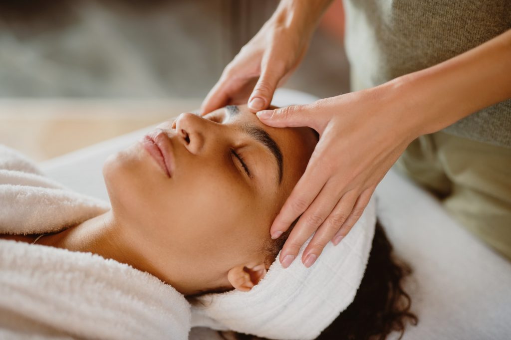 Closeup view of woman having facial massage.